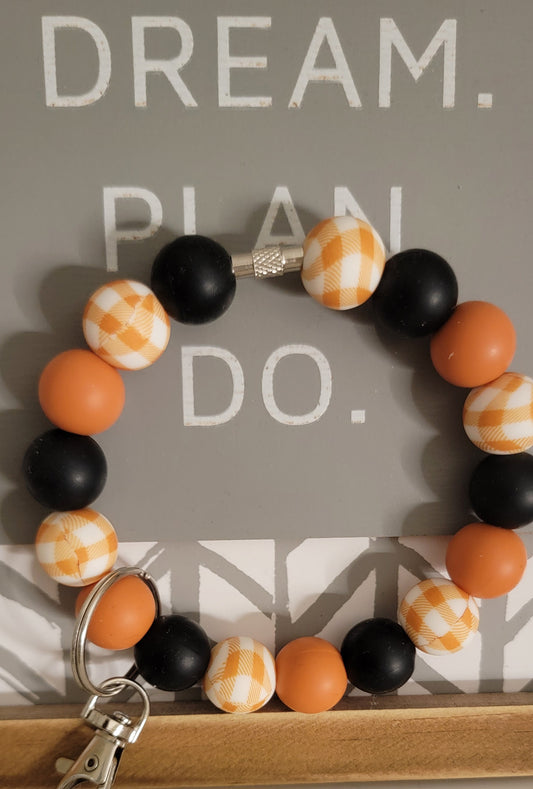 ORANGE PLAID WRISTLET